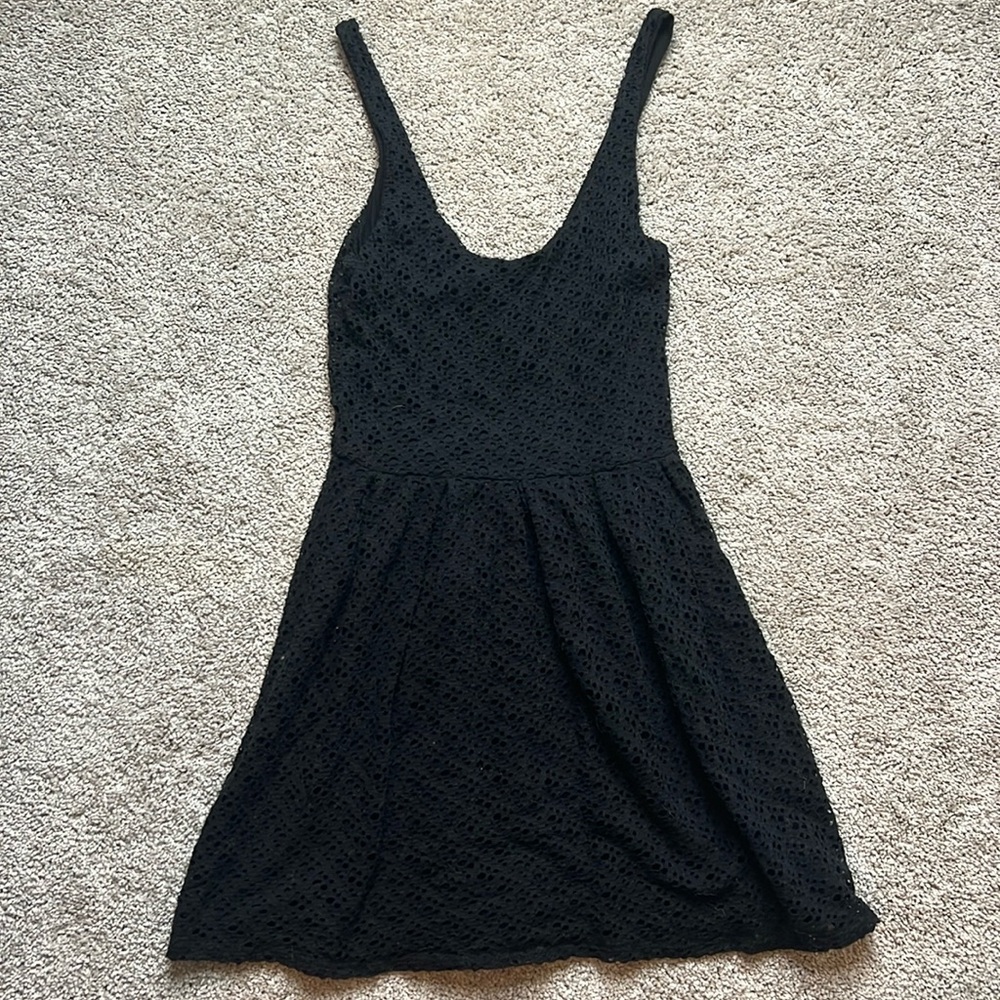 Women’s little black eyelet dress.